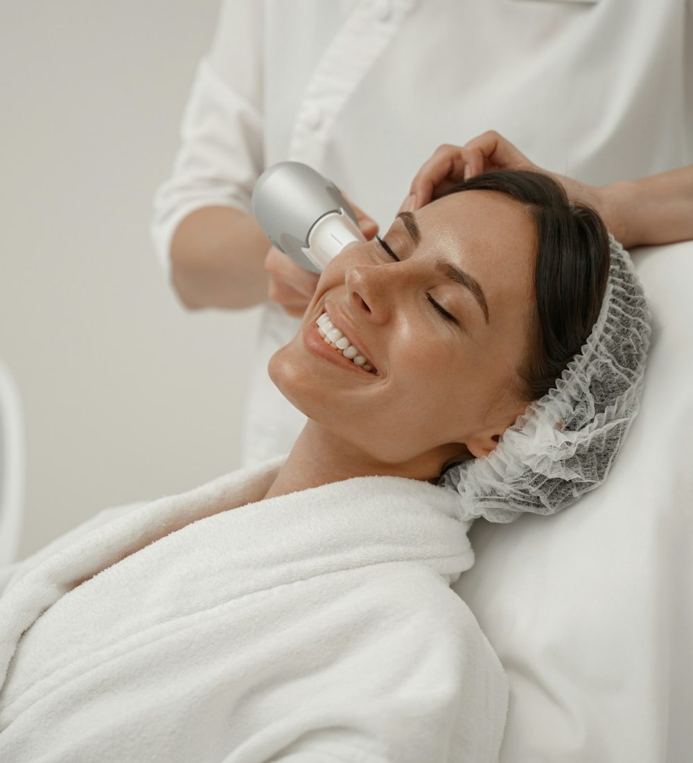 Professional cosmetologist is making cavitation rejuvenation skin treatment. Radio wave lifting