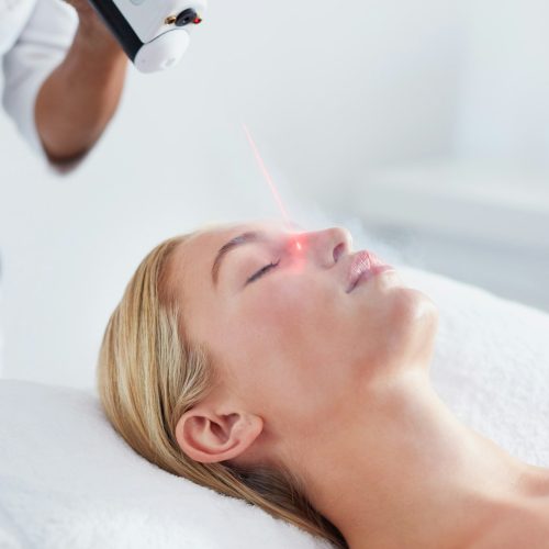 Woman undergoing local cryotherapy at spa